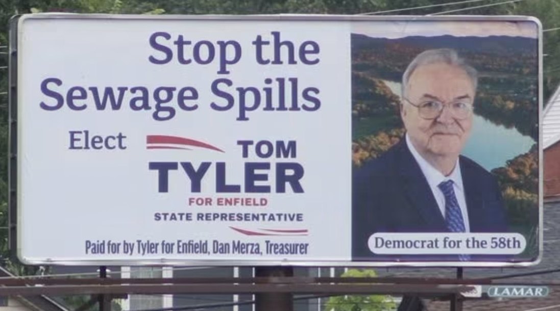 Tom Tyler campaign billboard reading Stop the Sewage Spills, Elect Tom Tyler for Enfield State Representative, Democrat for the 58th